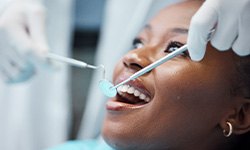 Invisalign patient being examined during a check-in appointment