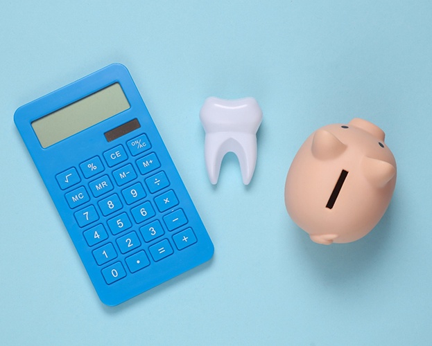 piggy bank, tooth, and calculator