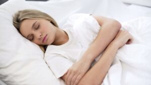 teen girl sleeping in bed